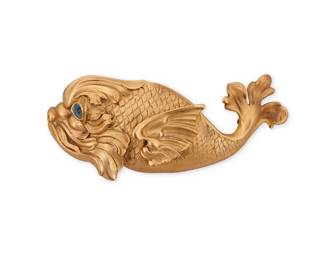 155 Christopher Ross: A Vintage Gold Tone Fish Belt Buckle Circa 1984 A heavy cast gold-toned metal buckle featuring a sculptural Classical-style fish with inset blue glass eye and acanthus leaf tail, signed and dated verso  Buckle: 3 1/2 in. H x 8 1/4 in. W x 1 1/2 in. D 364.8 grams gross Estimate: $200 - $300