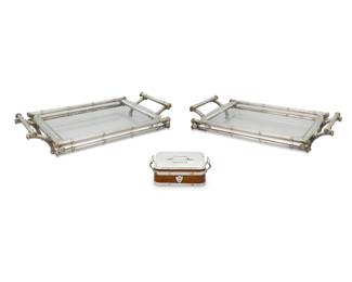 267 Two silver plated and glass entrée dishes and a lidded box Mid-19th century-20th century Box marked: TH / &S [Thomas Hardwood & Son, Birmingham] / EP / [crown] / [palmette] / S; each bamboo unmarked Comprising a silver-plate-clad lidded wood box with ceramic liner, and a pair of bamboo-form silver-plated serving trays with Pyrex liners, the box bearing an armorial 3 pieces Box: 2.625" H x 7" W x 5.375" D; Each bamboo: 3.625" H x 20.25" W x 11.25" D Estimate: $100 - $200