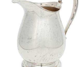 264 A Fisher Silversmiths Inc. sterling silver pitcher Mid-20th century With factory marks and: STERLING / 2026 9.375" H x 8.875" W x 5.875" D 17.9 oz. troy approximately Estimate: $500 - $800
