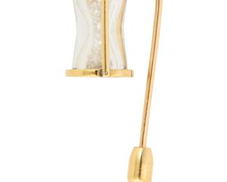 86 Sidney Mobell: An 18K Gold and Diamond Hourglass Pin Featuring loose round diamonds encased in a gold hourglass design, signed Sidney Mobell  Measures:1 1/2 in. 6.2 grams Estimate: $1,500 - $2,000