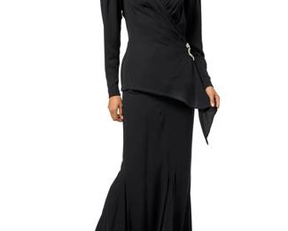 138 Emanuel Ungaro: A Black Silk Evening Skirt Ensemble Circa 1980s, France Labels: Emanuel Ungaro / Couture / Paris A two-piece black silk crepe skirt 'suit' featuring a long-sleeved front-wrap blouse with trapunto beaded panels to neckline front and back shoulders., large shoulder pads, and a cut-out back and asymmetric hem, the interior with black silk lining to bust and back, integral bust shaping and an integral waistband with snaps to join to the matching black silk fitted flared gored panel skirt, with a back zip, and partially lined in black silk, likely custom made 2 pieces  Blouse: bust across front: 16 1/2 in.; waist: 13 1/4 in.; hips: 18 in.; CB length: 26 1/2 in. Skirt: waist across front: 13 in.; hips: 19 1/2 in.; CB length: 44 1/2 in. Estimate: $300 - $500