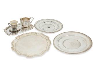 286 A set of twelve Sedlacek & Co. sterling silver place plates 1920s Each with factory marks and: STERLING / LOS ANGELES Each with bound-reed and shaped rim 12 pieces Each: 11" Dia. Total weight 194.8 oz. troy approximately Estimate: $7,000 - $9,000