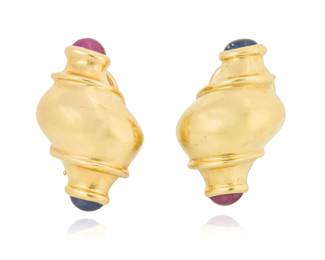 60 A Pair of 14K Gold and Gem-Set Earclips Of a shell design, capped by oval sapphire and ruby cabochons 2 pieces  Measures: 1 x 1/2 in. 16.1 grams gross Estimate: $800 - $1,200
