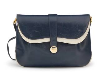 174 Ferragamo: A Vintage Navy & White Leather Shoulder Bag Marked to interior: Salvatore Ferragamo / Made in Italy / Firenze 17 A navy double flap shoulder bag clutch with contrast white leather details, pleated front and magnetic strap closure, gold-tone branded hardware and detachable thin leather strap, the interior with pockets under each flap, and black leather lining  7 1/4 in. H x 10 3/4 in. W x 2 1/2 in. D; drop: 18 1/2 in. Estimate: $100 - $200