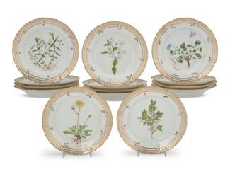 410 A set of fourteen Royal Copenhagen porcelain 'Flora Danica' dessert plates Date codes for 1949-1953 Each with green printed factory mark above underglaze blue wave and green painted pattern 20 over shape number 3551, black painted titles in Latin 14 pieces Each: 6.75" Dia. Estimate: $2,000 - $3,000