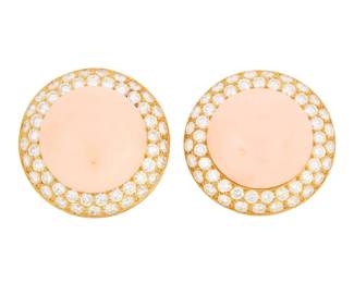 16 A Pair of Gold, Coral and Diamond Earclips Featuring two round coral cabochons, encircled by two rows of round diamonds weighing approximately 7.14 carats 2 pieces  Measures: 1 x 1 in. 22.7 grams Estimate: $1,000 - $1,500