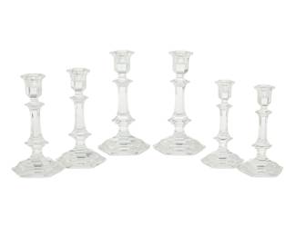 361 A set of six Baccarat glass 'Harcourt' candlesticks Late 20th century Each with etched factory mark Comprising three pairs in graduated sizes 6 pieces Largest: 8.875" H x 4.25" W x 4.75" D; Smallest: 7" H x 3.25" W x 3.625" D Estimate: $400 - $600