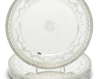 290 An English sterling silver footed salver 1992 With British hallmarks for sterling, Sheffield, date, and maker: RC [in hexagonal cartouche, Carr's] With scalloped rim, raised on three scrolled feet 1.25" H x 12" Dia. 28.4 oz. troy approximately Estimate: $700 - $900