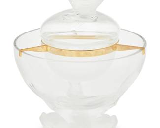 393 A Lalique glass 'Igor' caviar bowl Late 20th/early 21st century Designed in 1969 by Marie-Claude Lalique (1935-2003) Etched: Lalique ® France In four pieces, with gold-plated metal support and dolphin-form finial and tripod base Overall: 10.25" H x 7.875" Dia. Estimate: $700 - $900