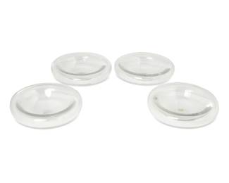 348 A set of four Oggetti glass bowls Late 20th century Each with two applied labels: Oggetti / Miami / Made in Italy / Marshall Todd's / The Glass Menagerie / Beverly Hills 4 pieces Each: 2.75" H x 9.125" Dia. approximately Estimate: $200 - $400