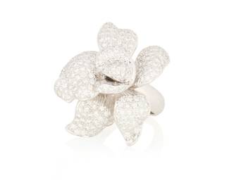 37 An 18K White Gold and Diamond Ring Of a dimensional floral design set with pave diamonds weighing approximately 6.50 carats  Size: 6 3/4 15.7 grams gross Estimate: $2,000 - $3,000