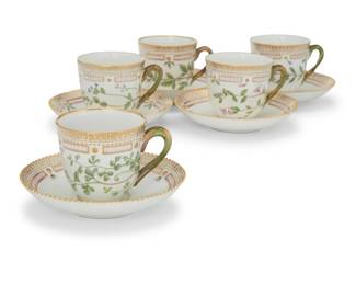 405 A set of ten Royal Copenhagen porcelain 'Flora Danica' tea cups and saucers Date codes for 1958-1974 Each with green printed factory mark above underglaze blue wave and green painted pattern 20 over shape number 3597, black painted titles in Latin 10 pieces Each cup: 2.75" H; Each saucer: 5.375" Dia. Estimate: $2,000 - $3,000