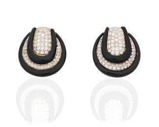 74 A Pair of 18K Gold, Onyx and Diamond Earclips Of a geometric design featuring carved onyx and pave-set diamonds weighing approximately 3.75 carats 2 pieces  Measures: 1 1/4 x 1 in. 28.6 grams gross Estimate: $2,500 - $3,500