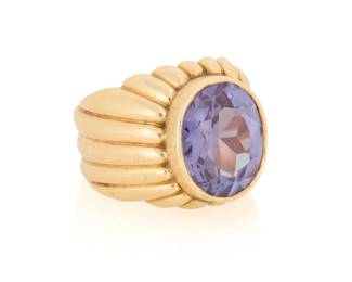 113 A 14K Gold and Synthetic Color-Change Sapphire Ring Centering an oval synthetic color-change sapphire weighing approximately 11.83 carats, finished with a fluted gold band  Size: 10 17.6 grams gross Estimate: $500 - $700