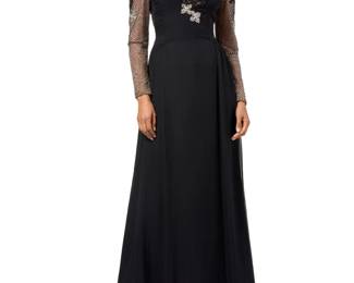 129 Nolan Miller: A Black Sequined Tulle & Beaded Evening Gown Circa 1980s-1990s Label: Nolan Miller A long fitted dress with dropped waist and A-line skirt, in black double layer silk chiffon/satin, with decorative dotted black tulle bodice with crystal and black sequins and diamanté floral and leaf arabesque motifs, the bodice backed in nude organza, and with an integral inner short boned corset, and back metal zipper  No size label: bust across front: 19 in.; waist: 14 in.; hips: 22 in.; sleeves: 25.5 in.; CB length: 60 in. Estimate: $200 - $400