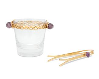 435 A Baccarat gilt metal mounted glass ice bucket and tongs Late 20th/early 21st century Bucket with etched factory mark Each mounted with amethyst 2 pieces Bucket: 4.375" H x 6" W x 4.375" D; Tongs: 6.875" L x 2.25" W Estimate: $1,000 - $2,000