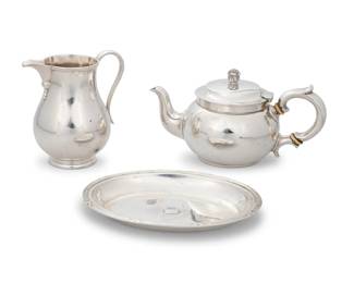 200 Three silver articles Three works:  A Tiffany & Co. sterling silver teapot, circa 1880s With factory marks and numbered: 6393 M [directorship of Edward Moore (1873-1891)] 7700; further marked: STERLING SILVER / 3 GILL / 2 1/4 CUPS 3.5" H x 7.25" W x 3.875" D  A Tessiers sterling silver cream pot, 1959 With British hallmarks for sterling, London, date, and maker: HP / LP [Herbert & Laurie Parsons as Tessiers]; further impressed: TESSIERS / LONDON 4.5" H x 4.25" W x 3" D  A small silver tray, late 19th/20th century Marked with a four-leafed clover, a profile bust, and numbered: 67397; XRF tested for .860 purity With central crown and black raised cartouche 0.75" H x 6.375" W x 4.75" D  3 pieces Total weight: 21.1 gross oz. troy approximately Estimate: $300 - $500
