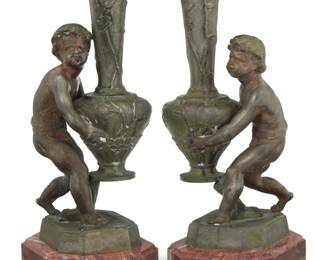 401 After Émile Laporte (1858-1907) A near pair of patinated spelter figural vases, 20th century Each signed to base: E Laporte Each mounted on a marble base 2 pieces Each overall: 11.25" H x 5" W x 4.25" D Estimate: $300 - $500