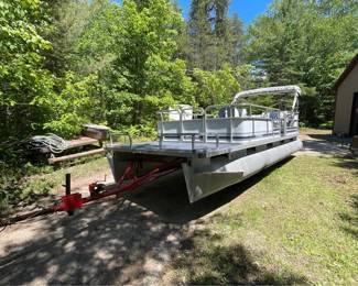 . . . 1989 Sylvan pontoon with 25 hp Honda motor and trailer!