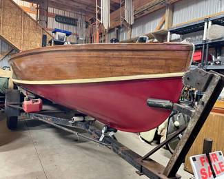 . . . side view of RARE Sorg cedar-strip boat w/trailer