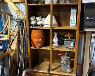 . . . nice cabinet filled with treasures: butter churn, stoneware water jug, and more!