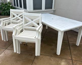 Hampstead rectangular patio dining table and stackable chairs painted in nautical white from Pottery Barn.