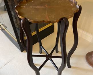 $95.00
15” scalloped brass tray top
	•	Removable tray style (typical of these)
	•	Curved dark wood legs
	•	X-form stretcher base
	•	Common import piece sold through department stores in the 60s–70s

These were very popular “Hollywood Regency / Colonial Revival accent tables.”