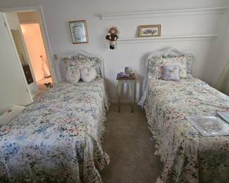 Pair of twin beds with wicker head boards including mattresses. $100 each