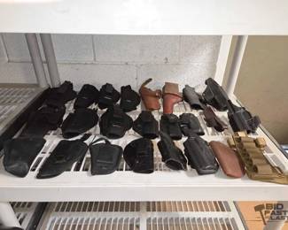 1428  23 Gun Holsters and 1 Knife Sheath 