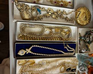 Many 1980 gold tone jewelry pieces