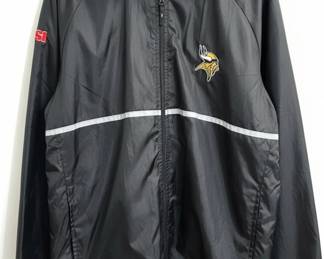 This is a black, lightweight, full-zip jacket by Dunbrooke, featuring the Minnesota Vikings logo embroidered on the left chest and an 'SI' (Sports Illustrated) logo embroidered on the left sleeve. The jacket is made of a shiny, likely nylon or polyester material, designed for casual wear or as a windbreaker. It includes reflective stripe detailing across the chest and a mesh lining for breathability. The collar is a stand-up style, and the cuffs and hem appear to be elasticated. The jacket is labeled as size XL and made in China.