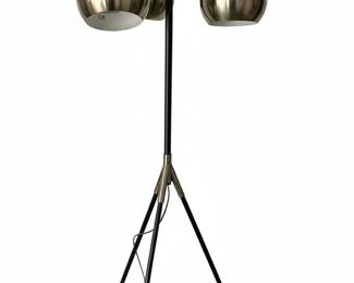 This floor lamp embodies a Mid-Century Modern aesthetic with its Sputnik-inspired design. It features a central stem with a tripod base, supporting three spherical shades that radiate outwards. The shades appear to be made of a brushed brass or bronze-toned metal with a satin finish. The stem and arms are finished in matte black, accented with brass details at the joints and base of the shades. The tripod base offers stability and contributes to the lamp's distinctive silhouette. The lamp is constructed from metal and is marked 'MADE IN CHINA' with a UL certification.