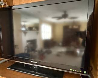 This is a Samsung LN40C530F1F, a 40-inch Full HD 1080p LCD television. Manufactured in May 2010, it features a sleek black bezel and a matching stand. The TV supports a 60Hz refresh rate and offers multiple connectivity options typical for its era, including HDMI ports. Its design is characteristic of mid-range televisions from the early 2010s, prioritizing a slim profile and a clear display for its resolution.