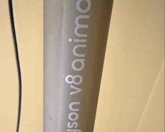 This is a Dyson V8 Animal cordless stick vacuum cleaner. It features a powerful digital motor for strong suction, a HEPA filtration system to capture allergens and fine dust, and specialized tools for pet hair removal, making it ideal for homes with pets. The vacuum is designed for versatility, converting easily from a stick vacuum to a handheld for cleaning stairs, cars, and upholstery. Its lightweight design and cordless operation offer convenience and maneuverability.