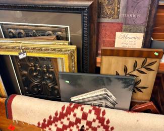 A variety of frames and framed pictures and wall art
