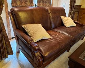 Brown Leather Sofa with Carved Wood Accents by TS Berry