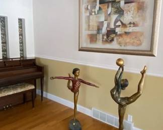  Two large hollow-cast bronze alloy gymnast sculptures (42" and 49" tall), mounted on metal bases.