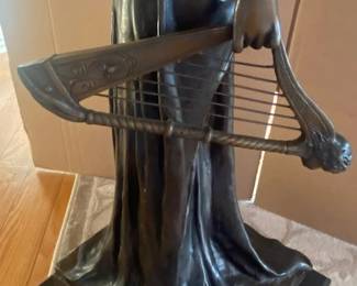 Harp detail showing refined casting and patinated finish.