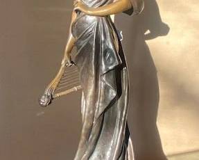 Signed bronze sculpture “The Harpist” by Georges Van der Straeten, stamped “A.P. 8654” and bearing the Société des Bronzes de Paris foundry mark. Approx. 32.5" H (figure); approx. 35" overall height including marble base.
