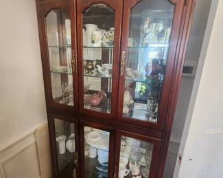 Lighted cherry curio cabinet
