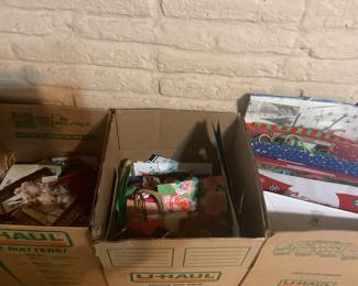 3 large boxes filled with gift bags 