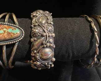 First cuff bracelet by P. Platero. Second Cuff bracelet is by Ronnie Willie. Both sterling by Navajo. The three set of bracelets are sterling. 