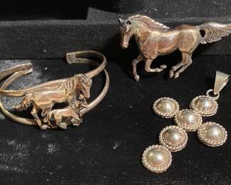 Cuff bracelet and horse pin are sterling. Cross charm is Mexico 925