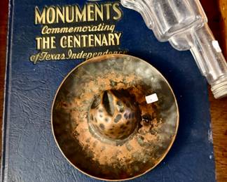 LOTS OF ANTIQUE CANDY CONTAINERS AND VINTAGE COPPER COWBOY HAT ASHTRAYS.