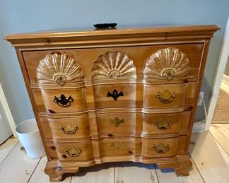 Carved wood dresser with shell motif