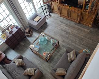 From a Tommy Bahama wall unit to couches,  brass coffee table, mahogany side tables, hutch even an antique hand truck 