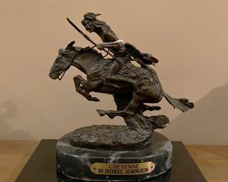 This is the Remington statuette.  It is "Cheyenne" by Frederic Remington.