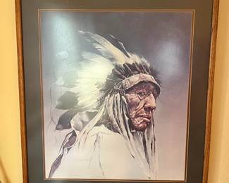 From the headdress, it seems this is a leader among his people.  Also, the work is signed and numbered.