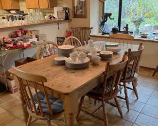 This is a lovely country-style dining table and chairs, along with a dish set.