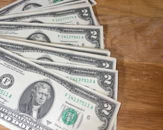 Collection of 80 consecutive serial number two dollar billS
